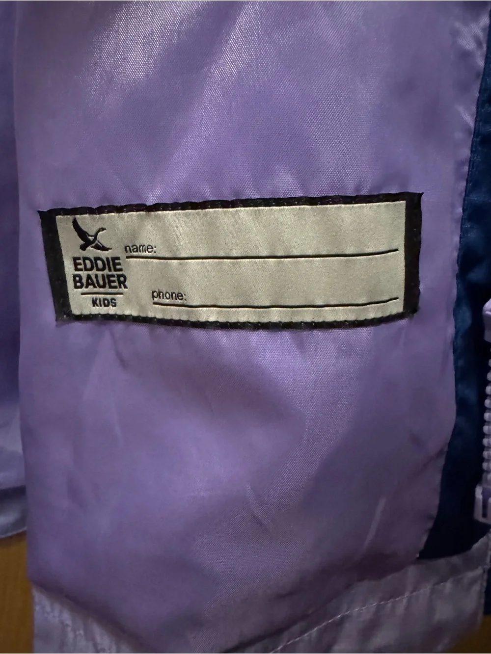 NWOT Kids Eddie Bauer two toned windbreaker. Full zip, size kids Medium.